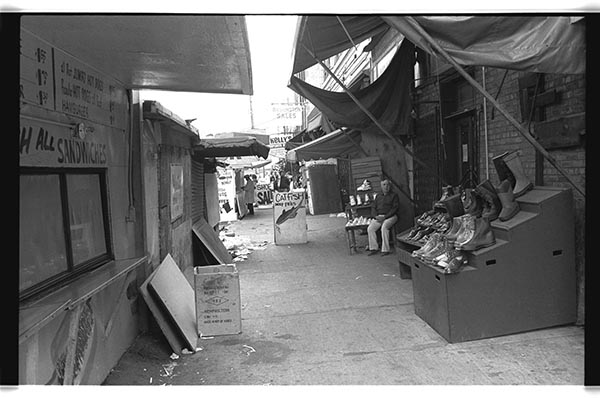 looking east on maxwell street w/ shoe vender