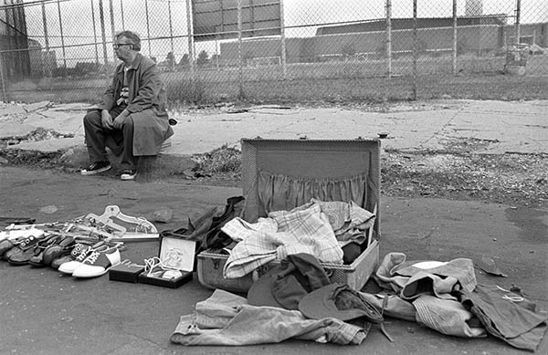 Vendor sitting on curb